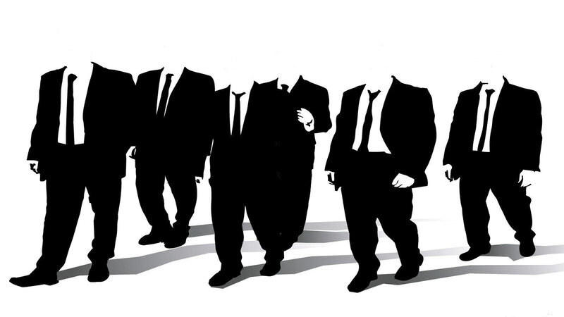 silhouettes of suited figures
