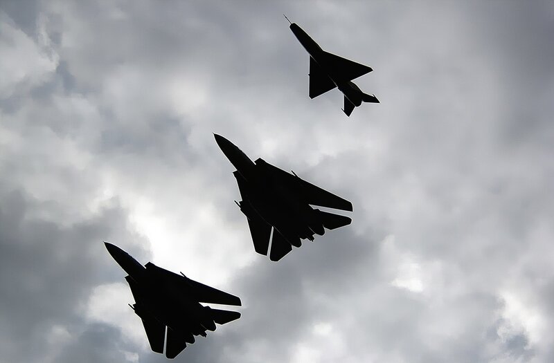 Silhouettes of three fighter jets