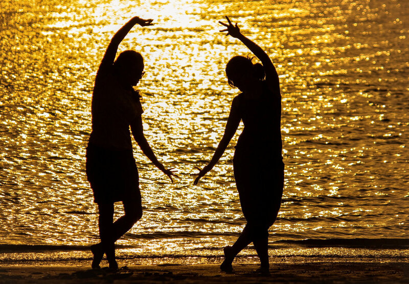 Silhouettes of Two Dancers
