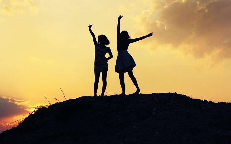 Silhouettes of Two Girls