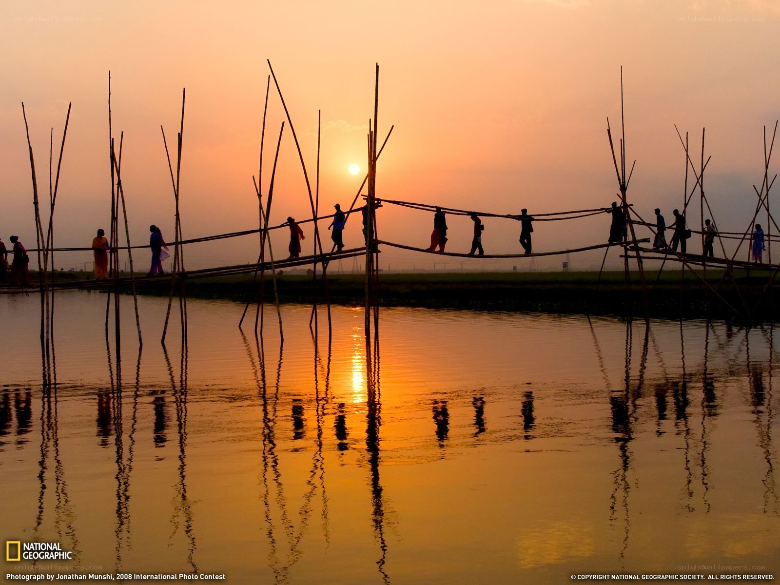 Silhouettes on a bamboo bridge