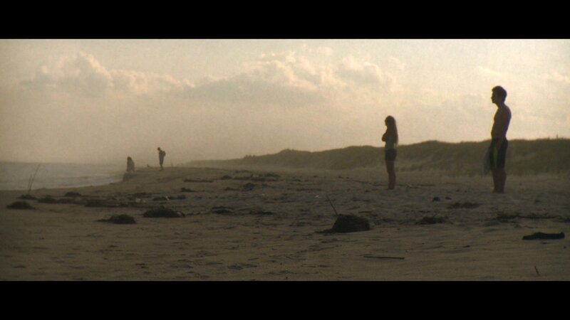 Silhouettes on a beach at dusk