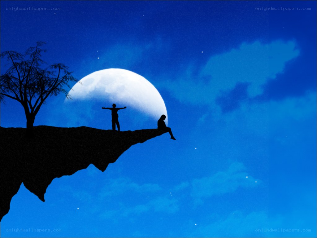 Silhouettes on a cliff at night