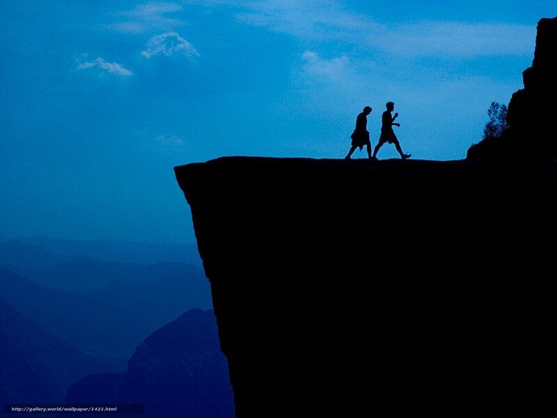 Silhouettes on a cliff edge