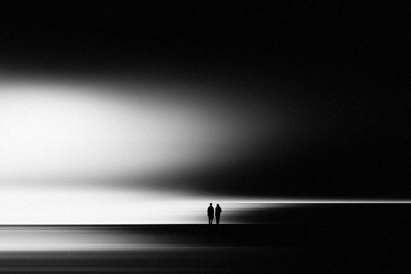 Silhouettes on a dark beach