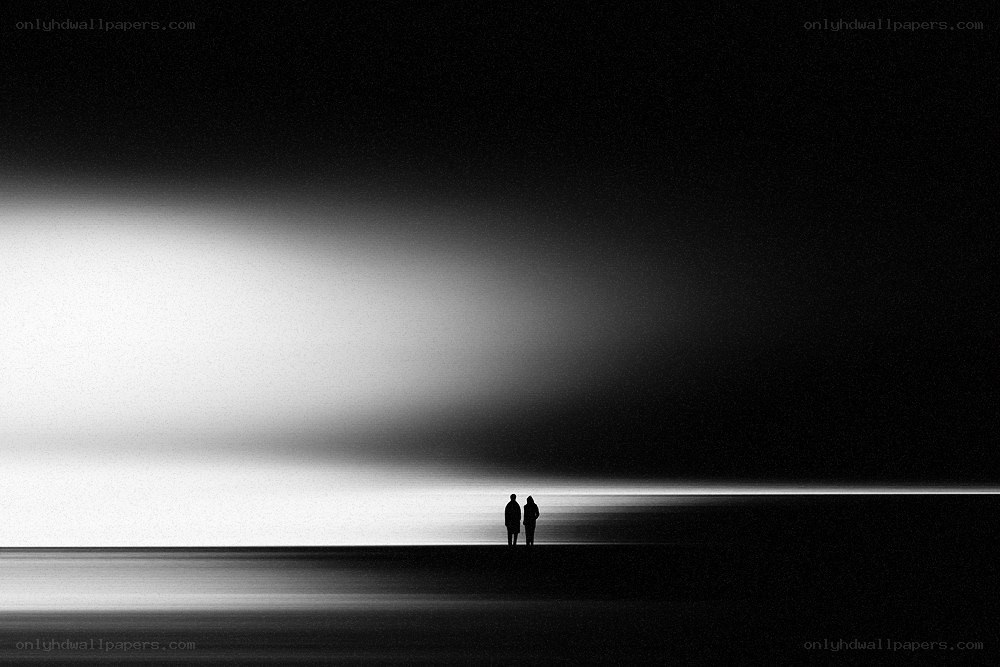 Silhouettes on a dark beach