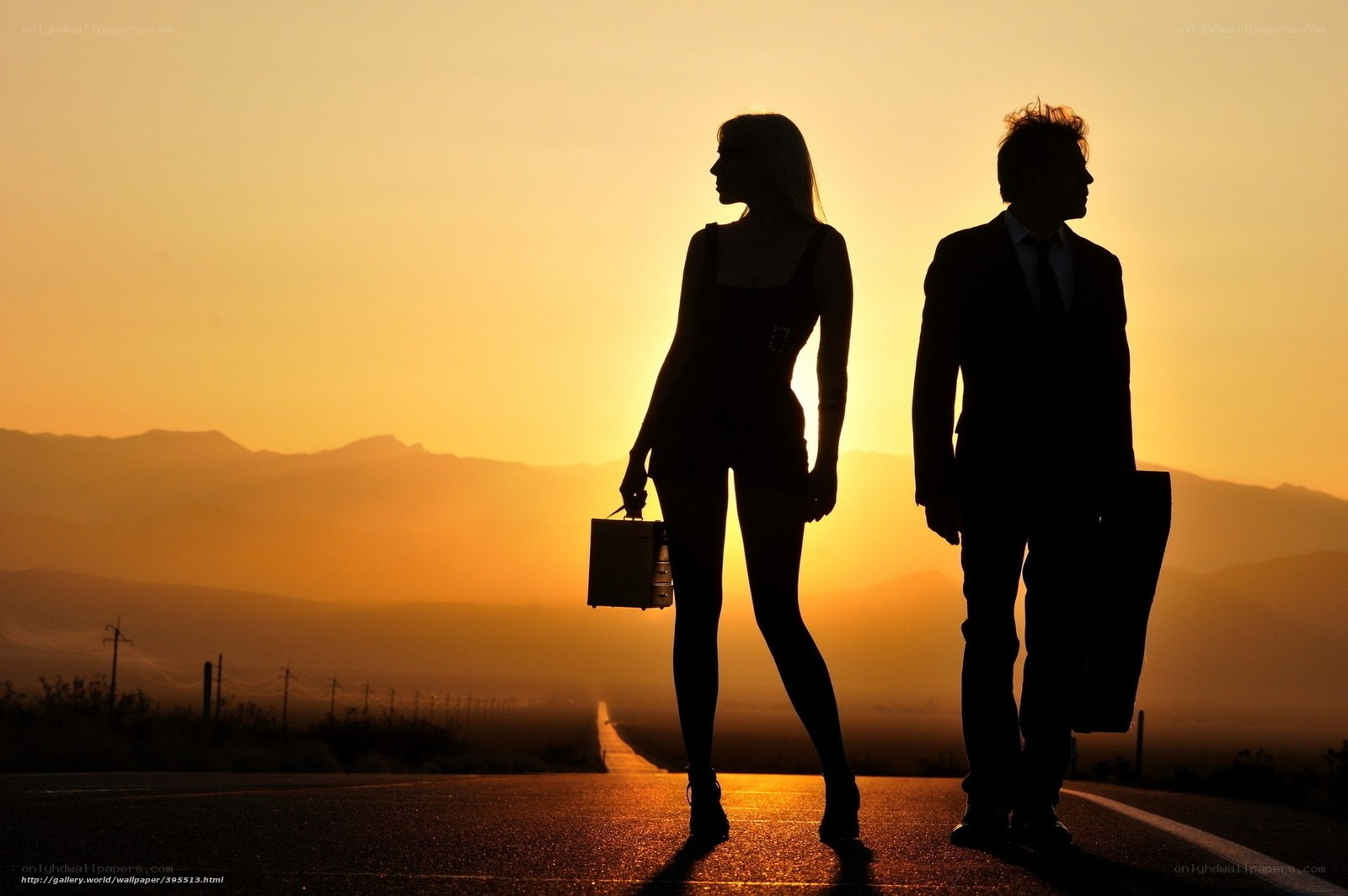 Silhouettes on a desert road