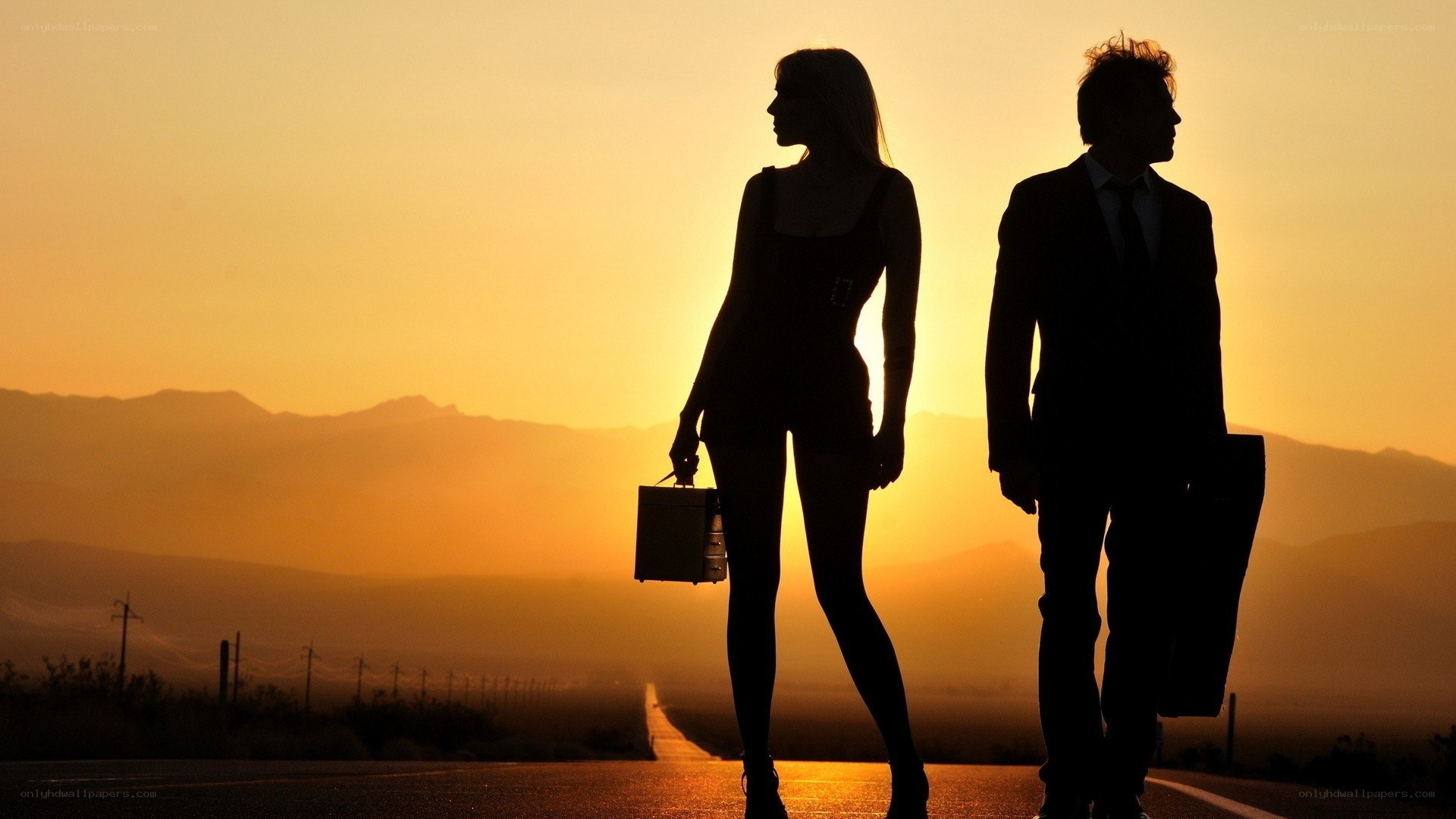 silhouettes on a desert road