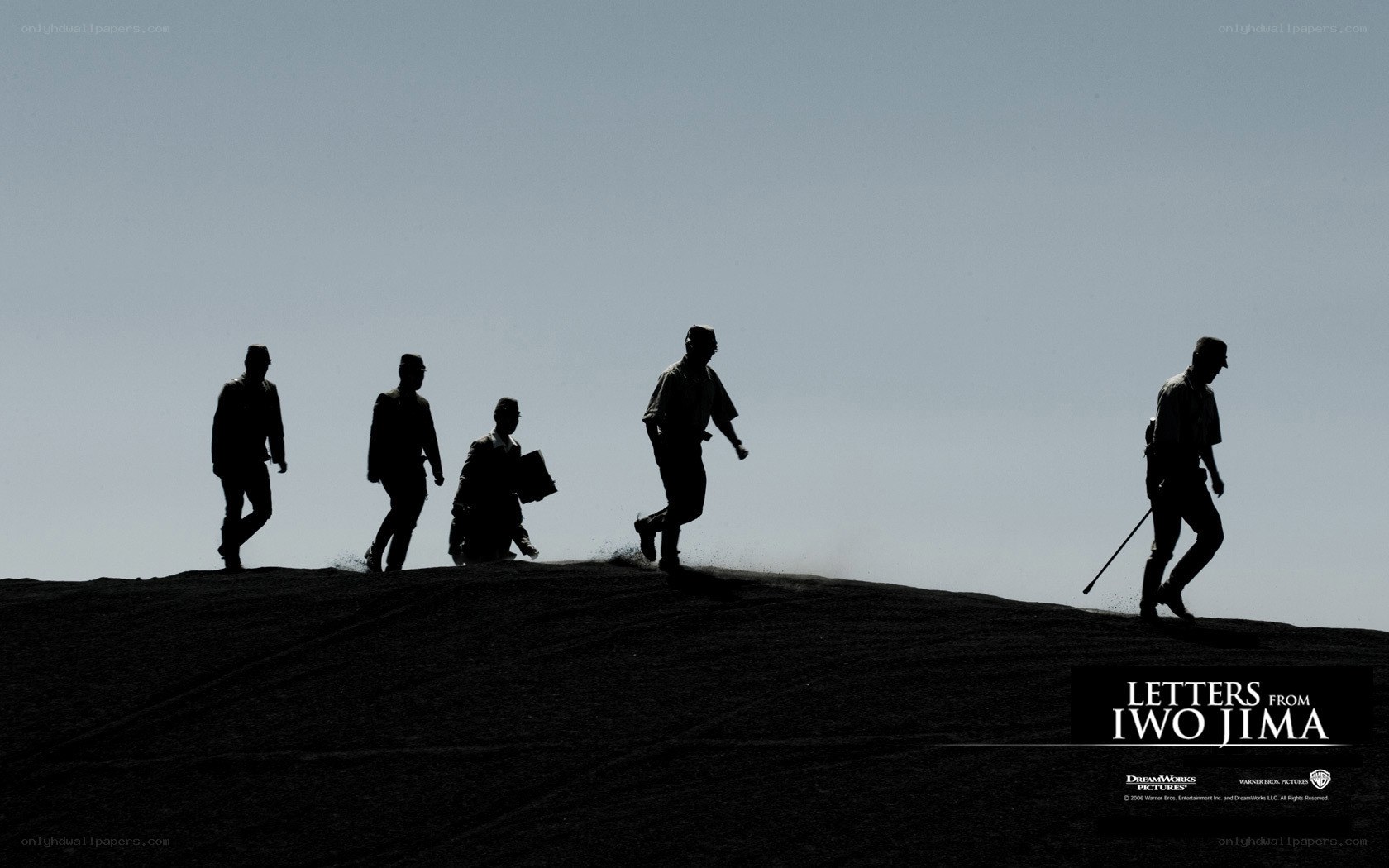 silhouettes on a hill