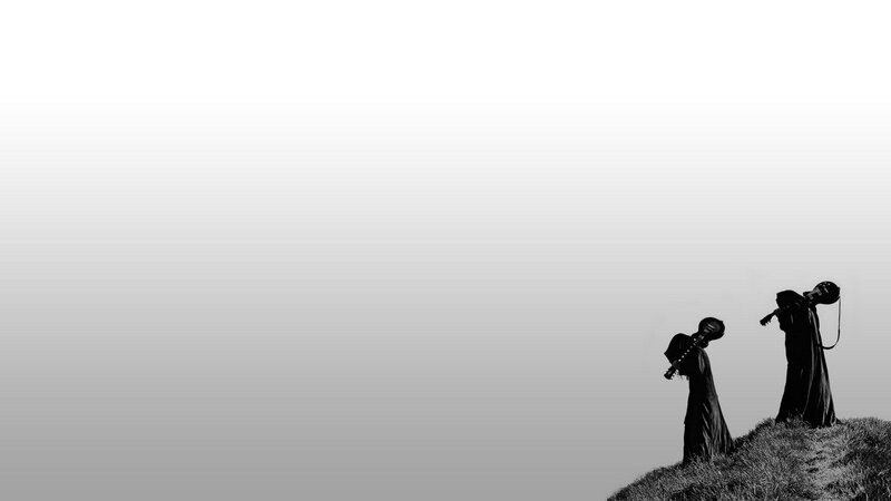 silhouettes on a hill