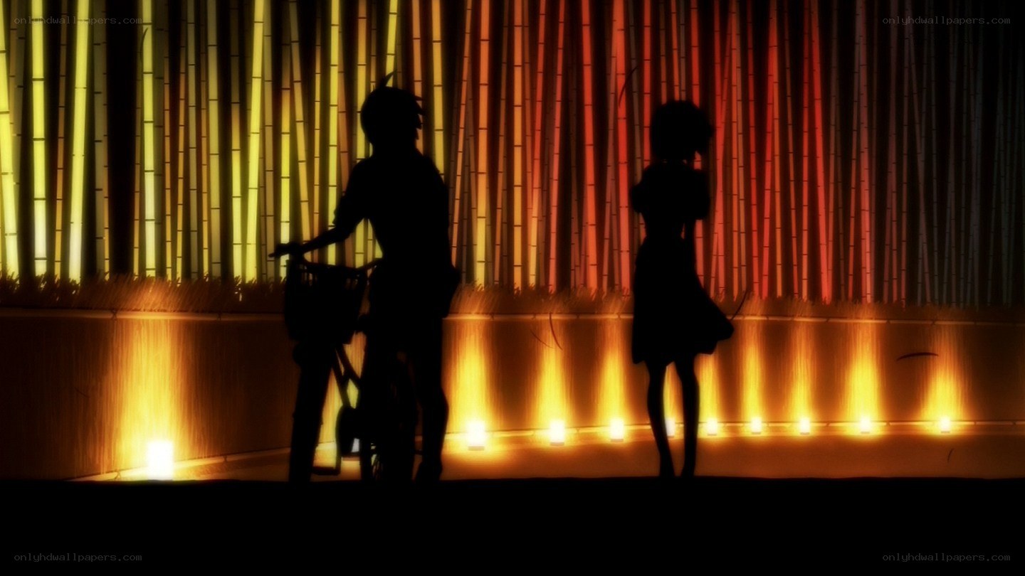 silhouettes on a lit stage