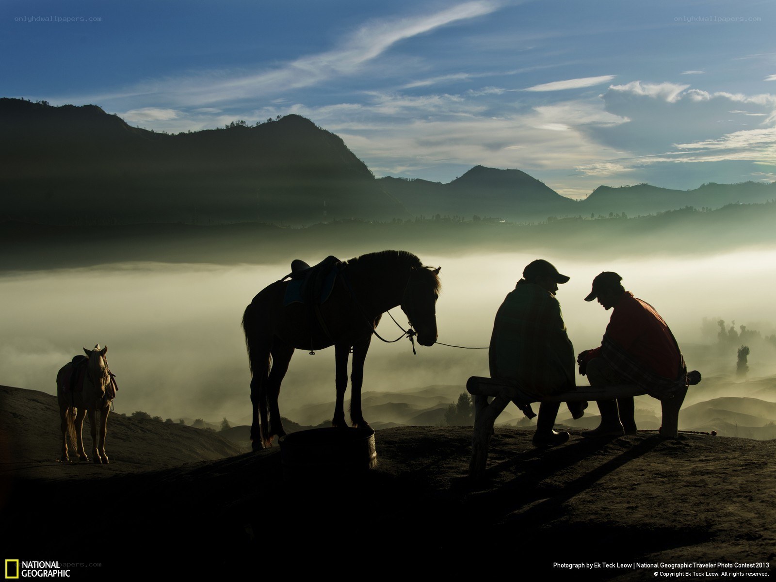 Silhouettes on a misty mountain