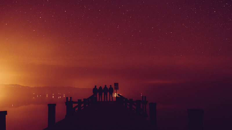 Silhouettes on a Pier — Red