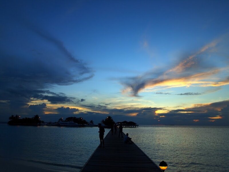 Silhouettes on a Pier
