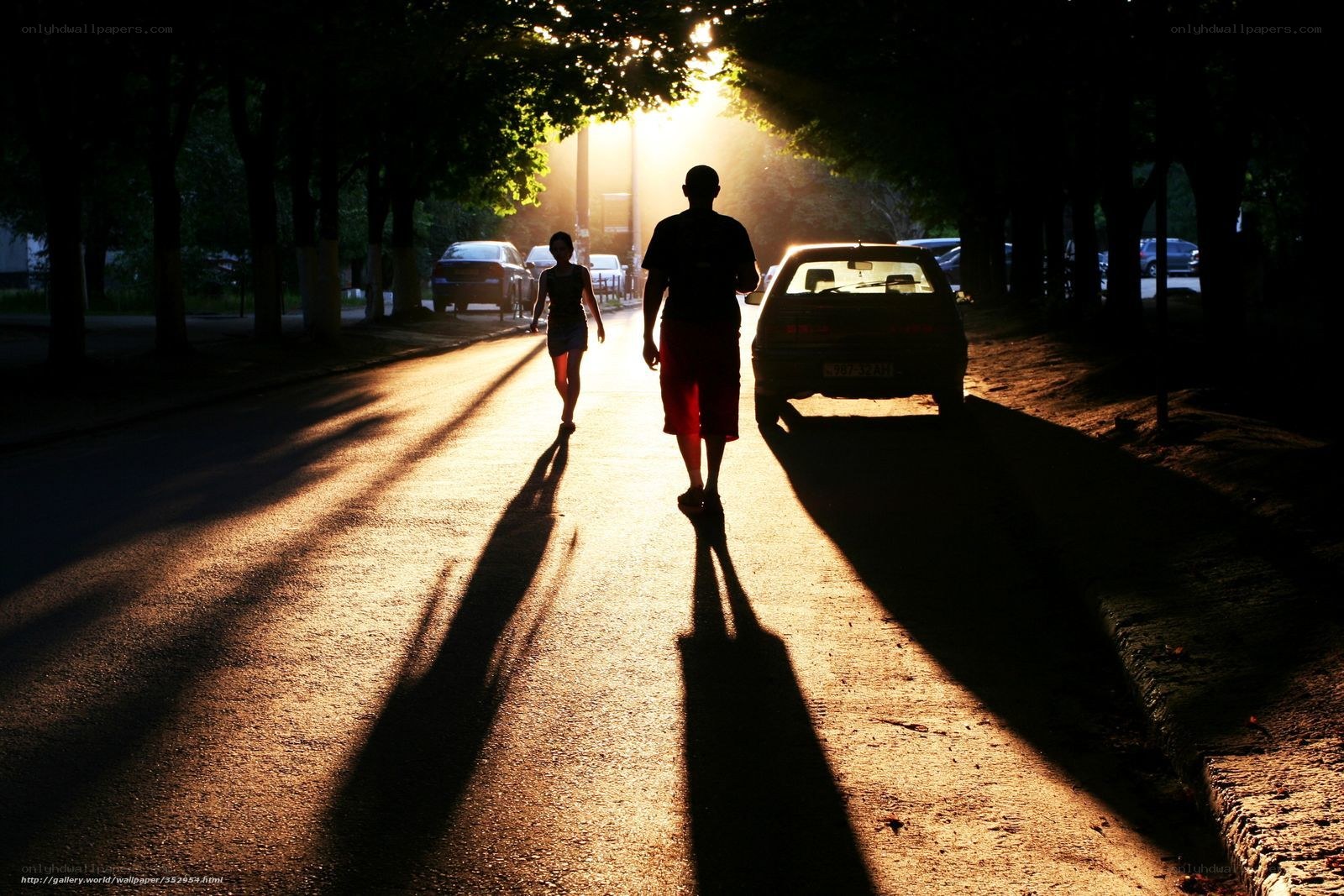Silhouettes on a sunlit street
