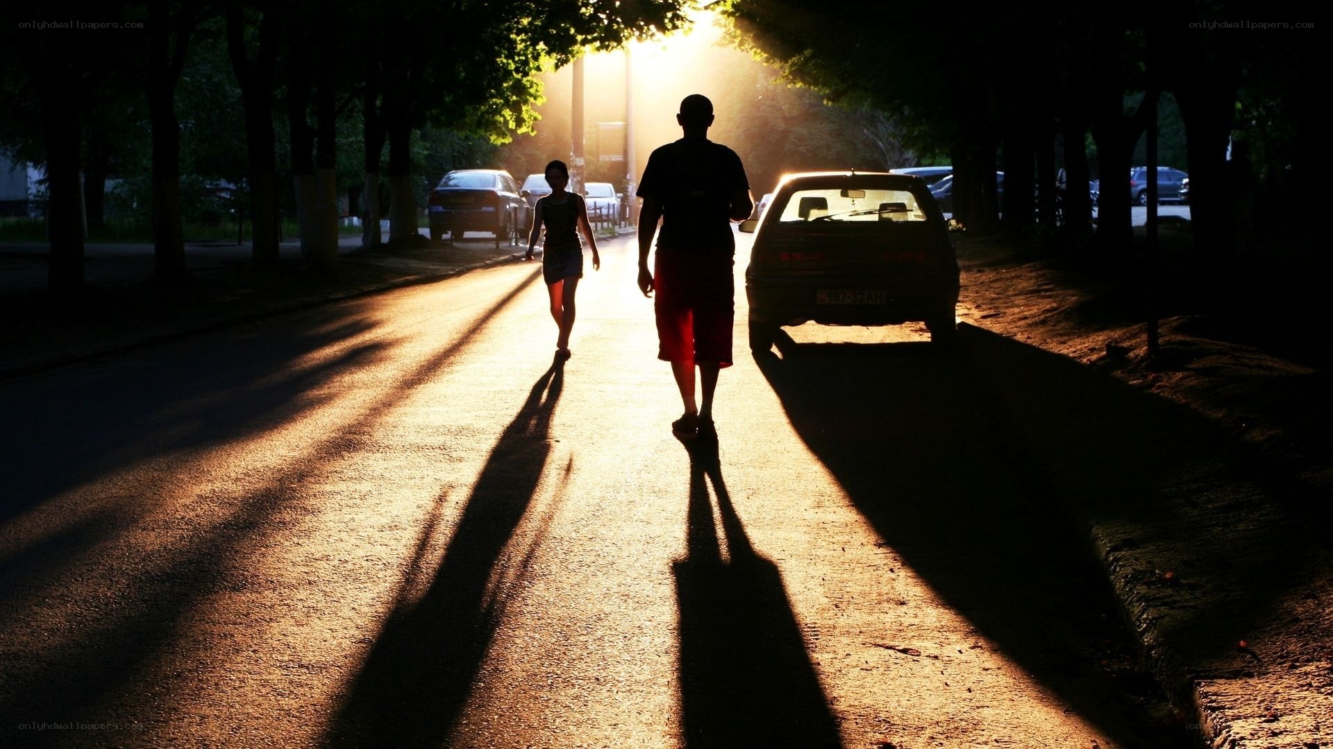 Silhouettes on a sunlit street