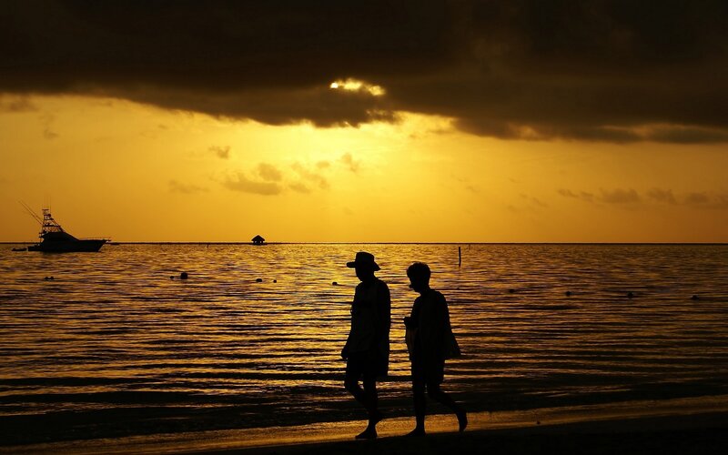Silhouettes on a sunset beach