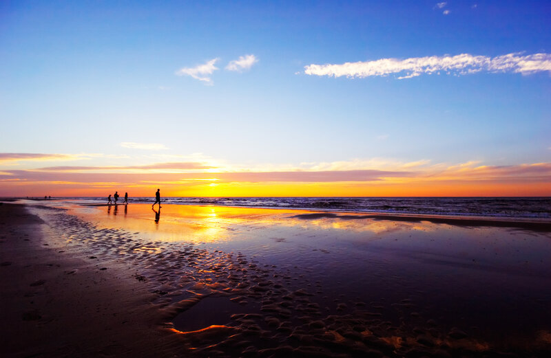 Silhouettes on Beach at Sunset — Blue