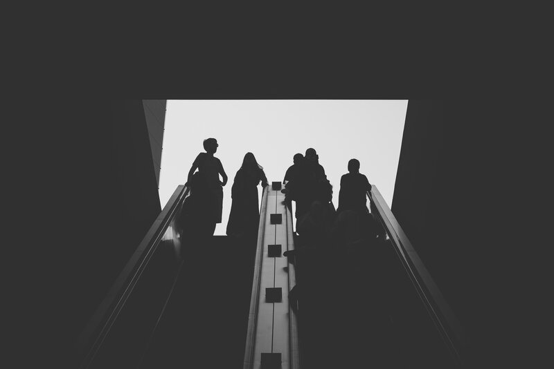 Silhouettes on Escalator