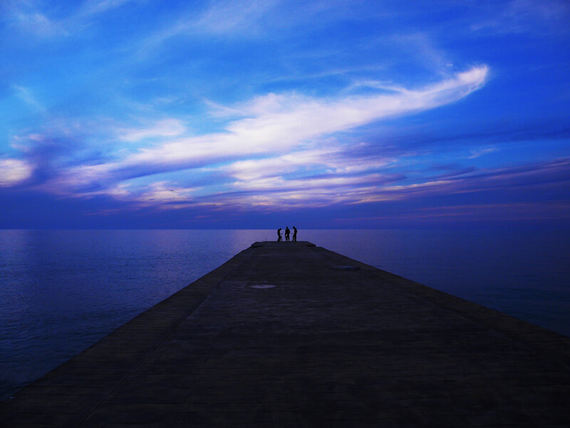 Silhouettes on Pier