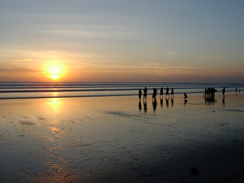 Silhouettes on the beach at sunset