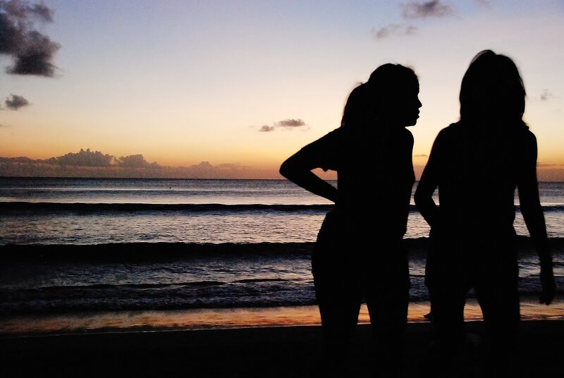 Silhouettes on the beach at sunset