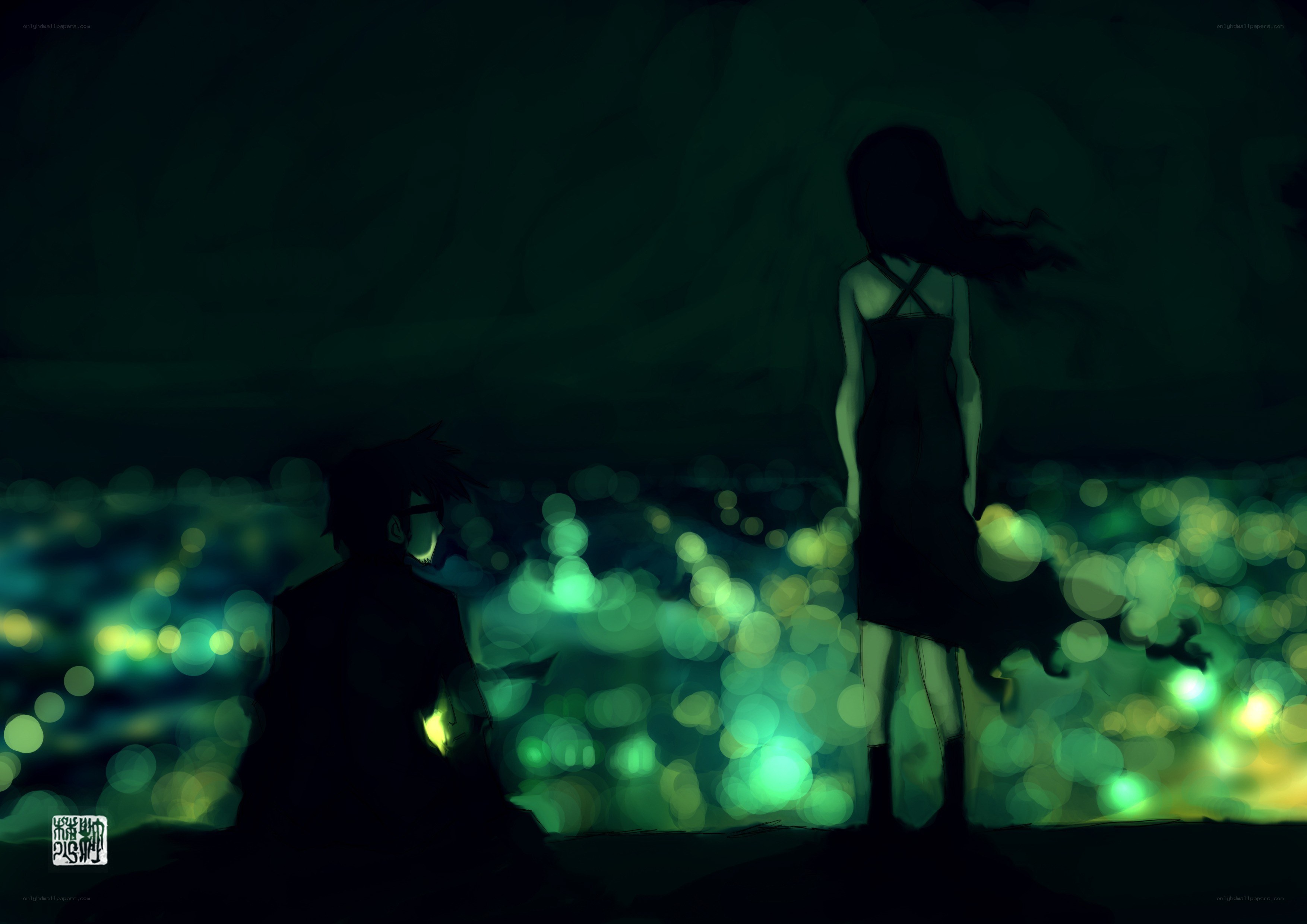 Silhouettes overlooking a glowing city