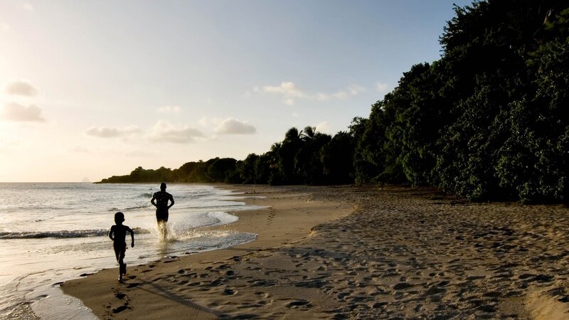 Silhouettes Running on Beach