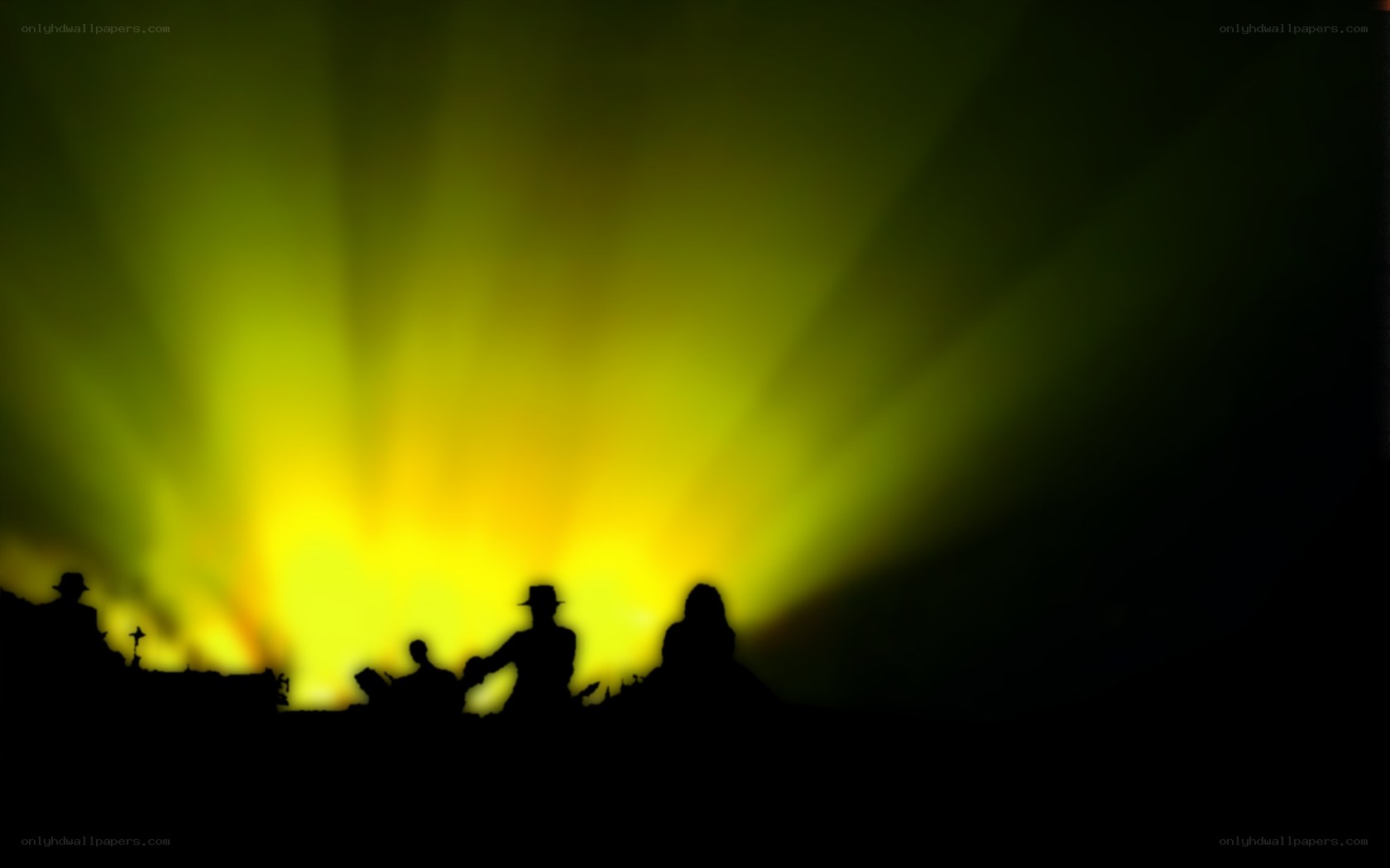 Silhouettes under green lights