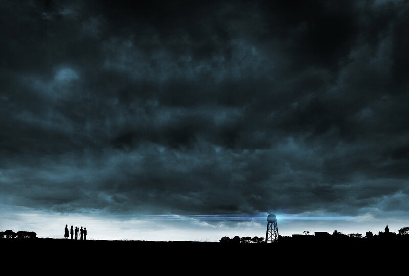 Silhouettes under stormy sky