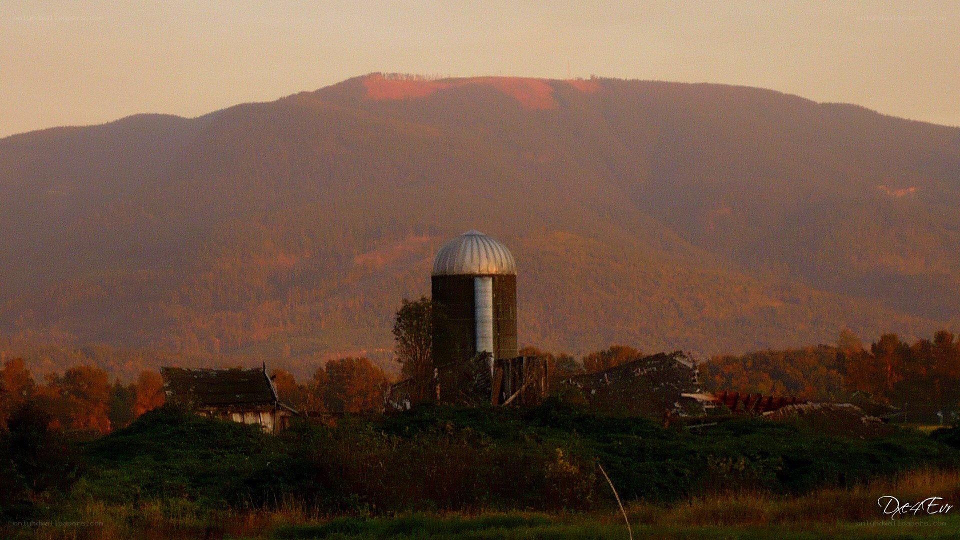 silo at sunset with mountains