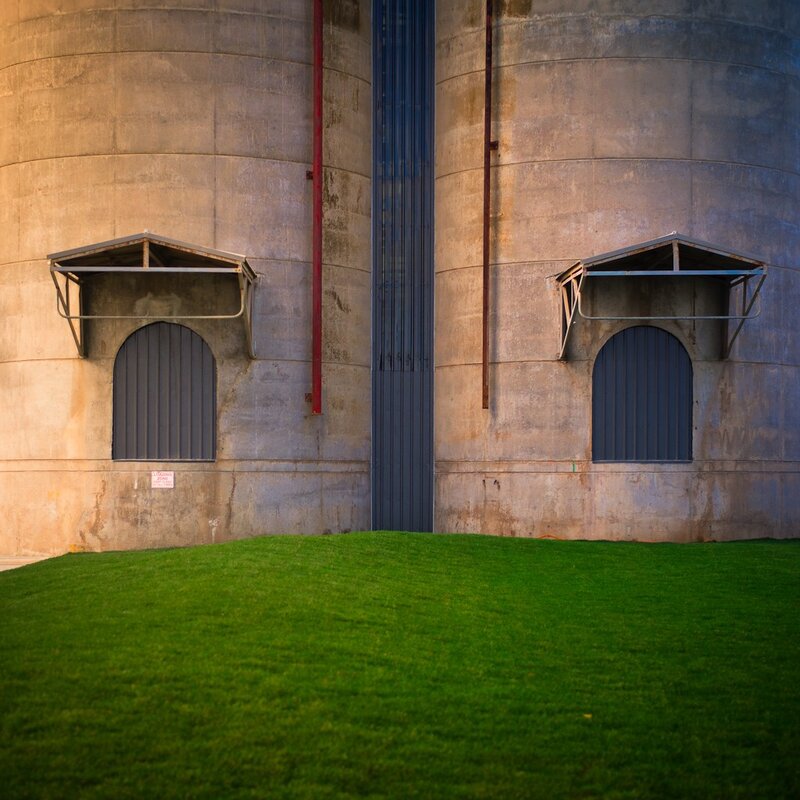 Silo walls with green lawn