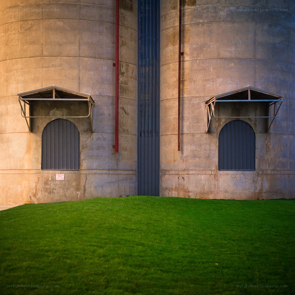 Silo walls with green lawn