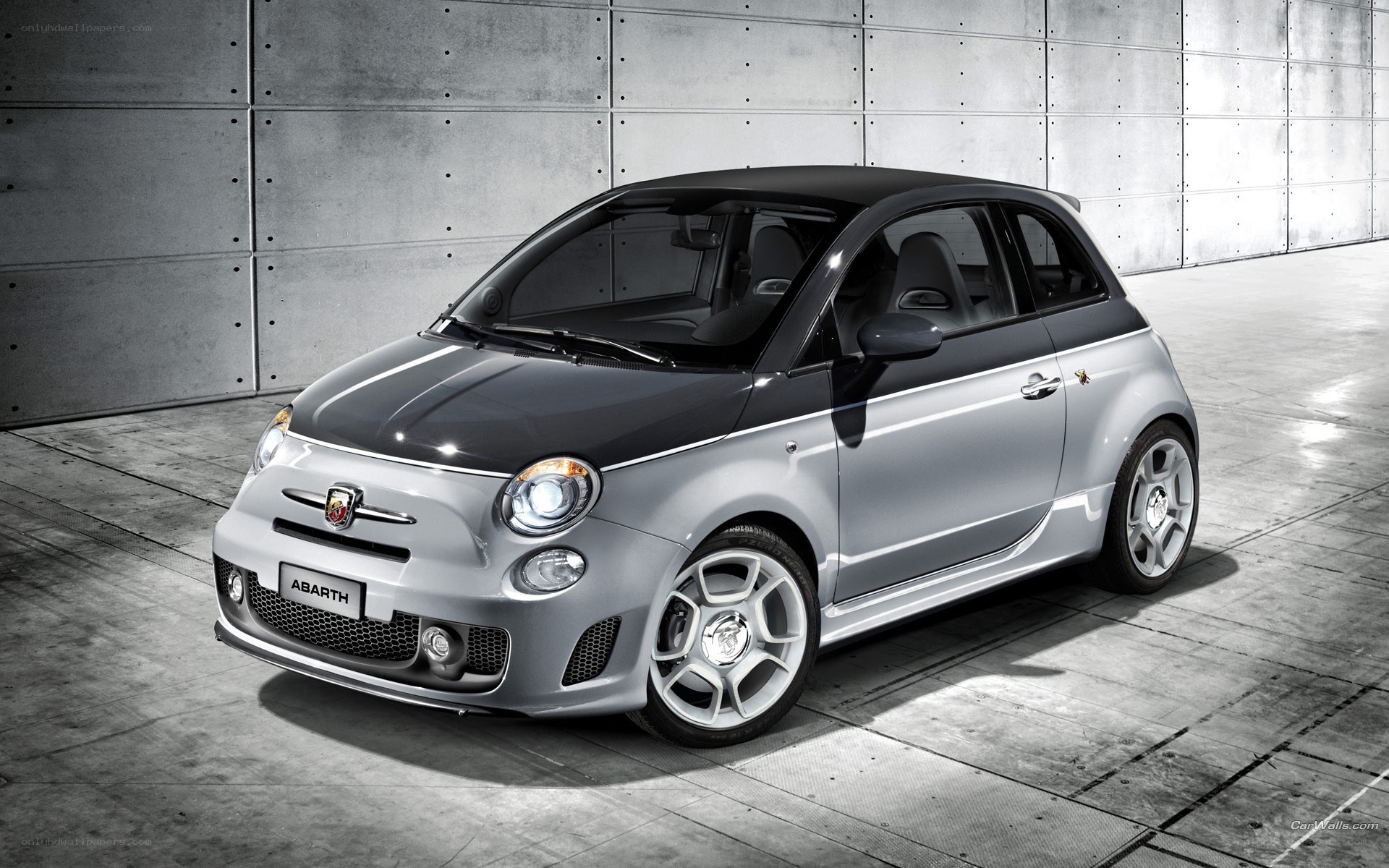 Silver Abarth car in garage