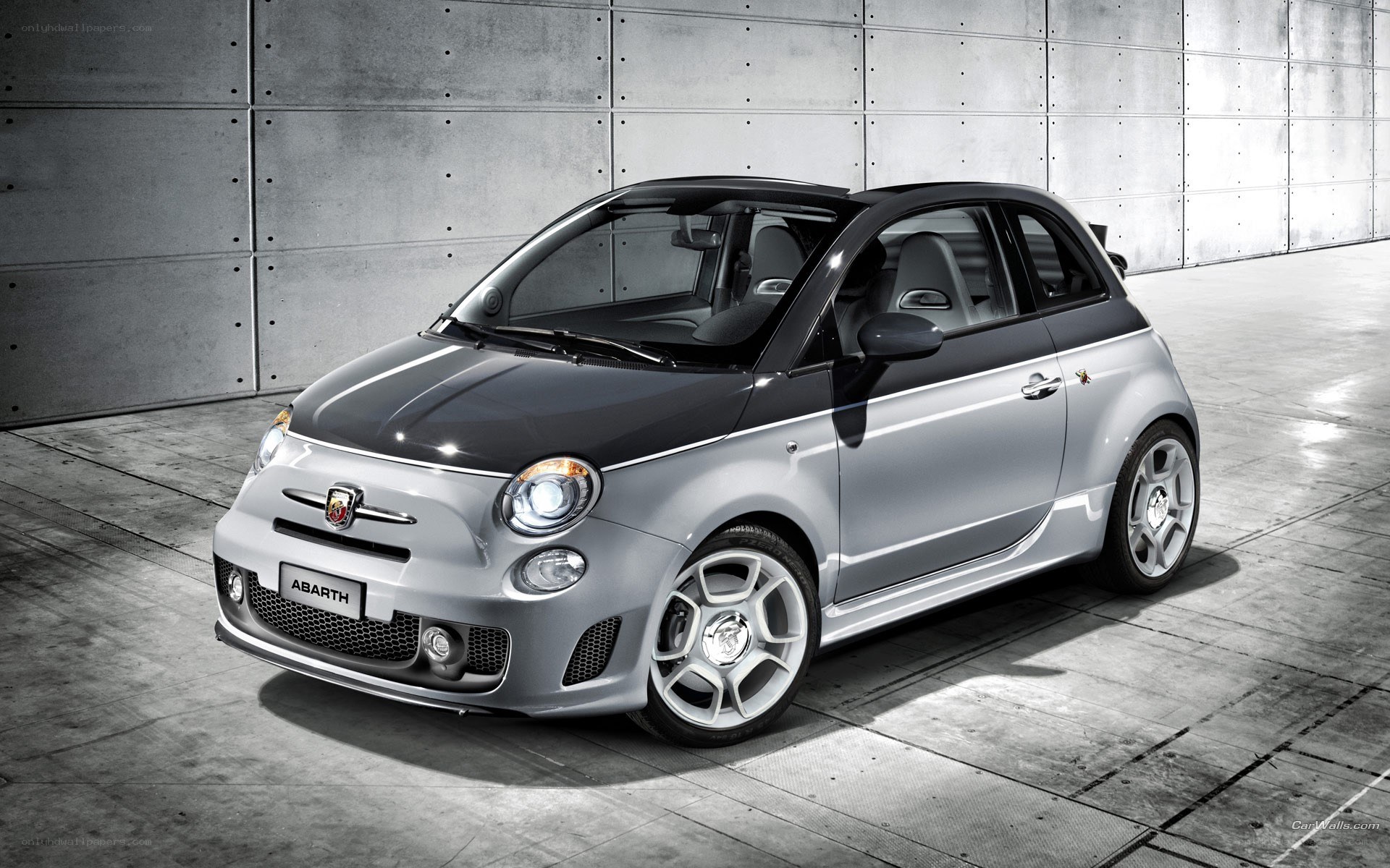 Silver Abarth car in garage