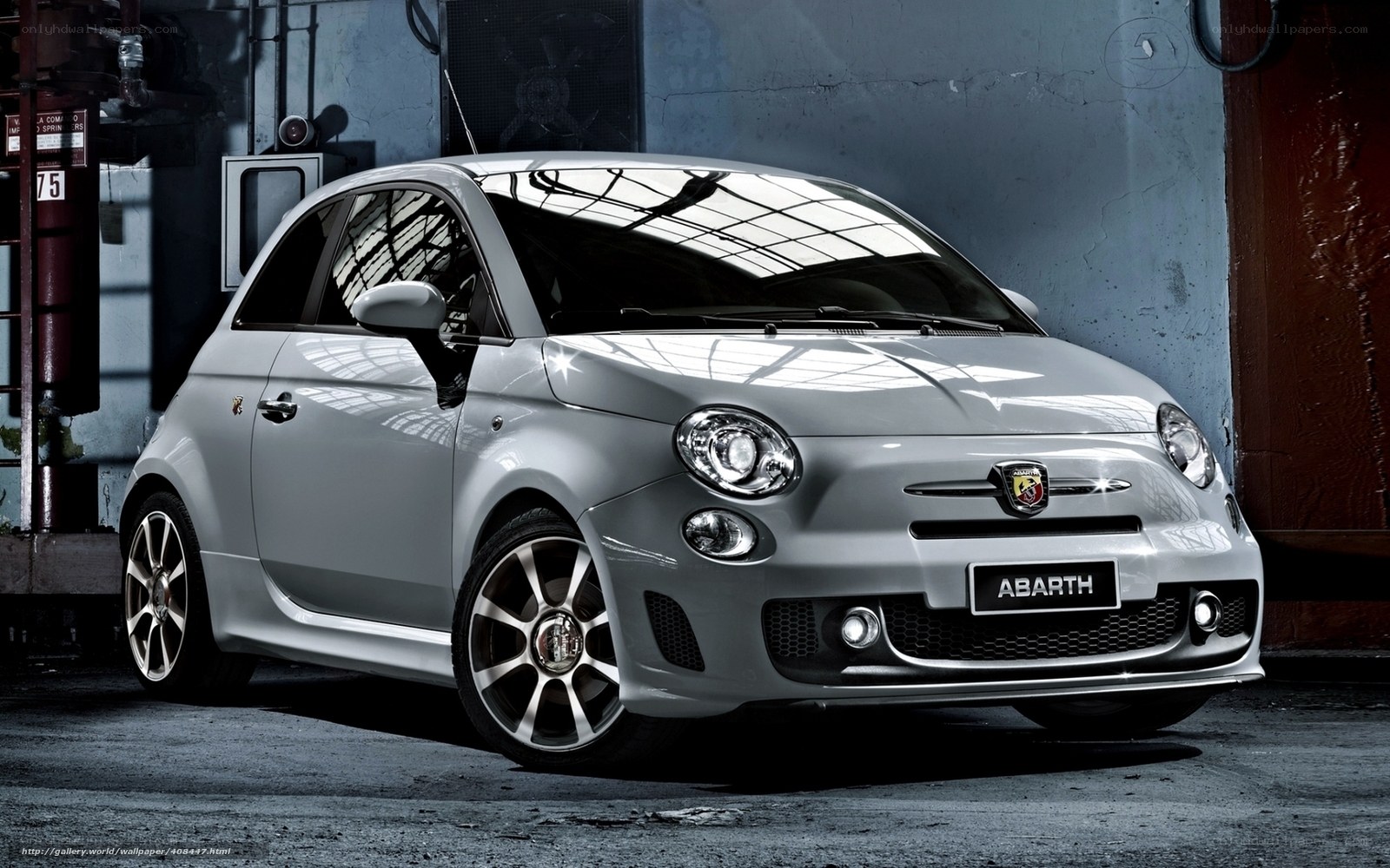 Silver Abarth car in garage