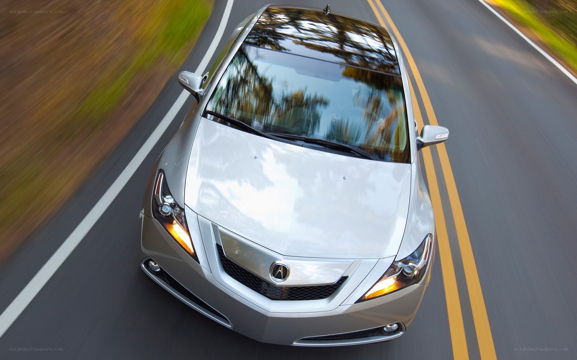 silver acura car on road