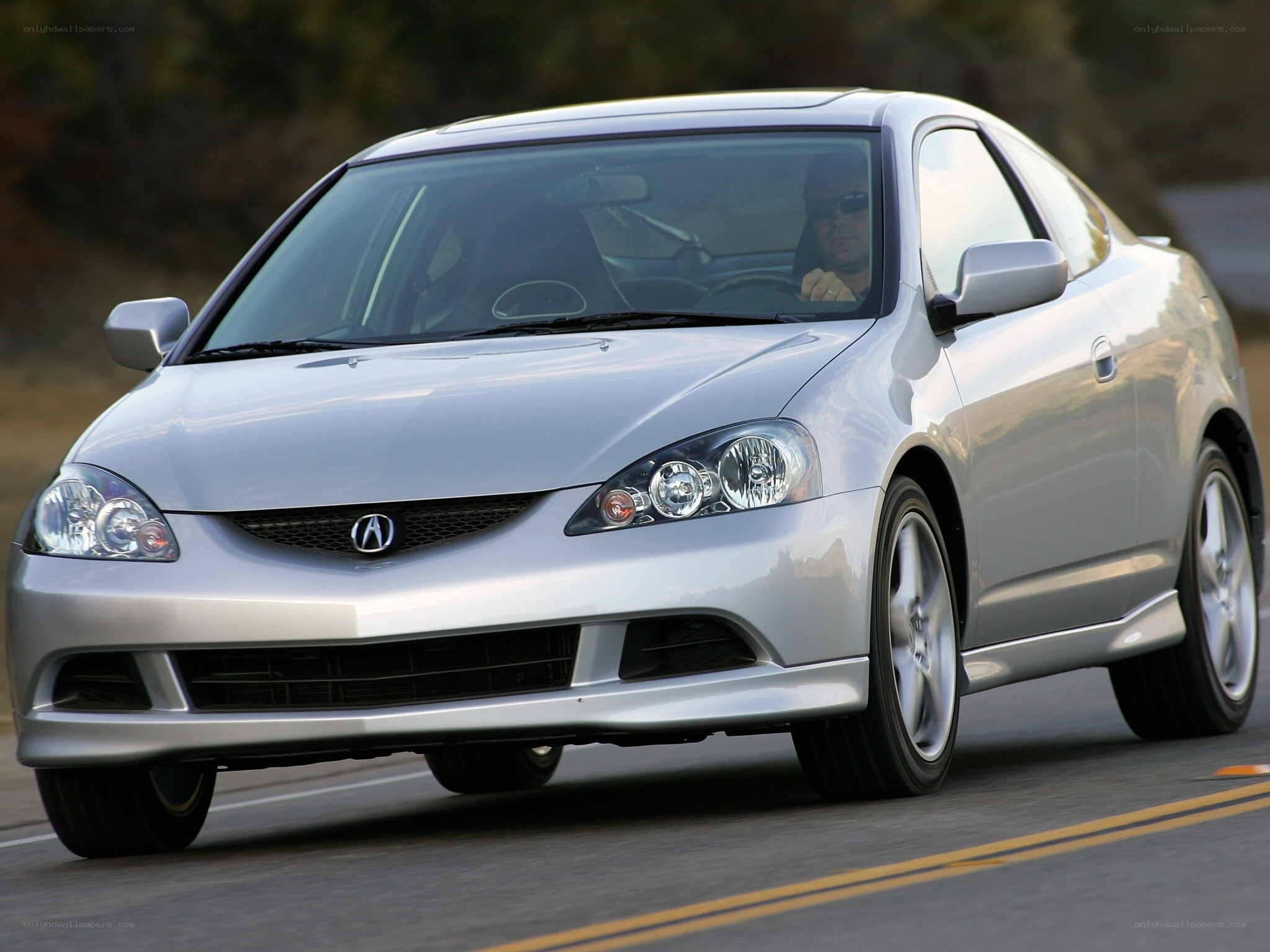 silver acura coupe driving