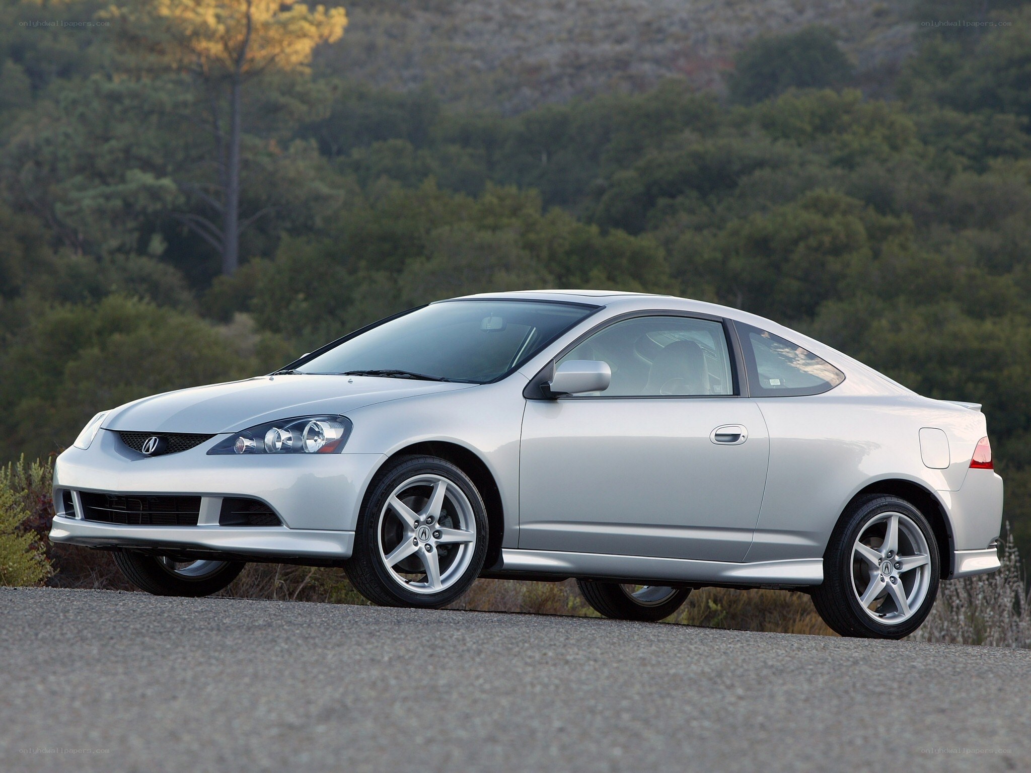 silver acura coupe on road