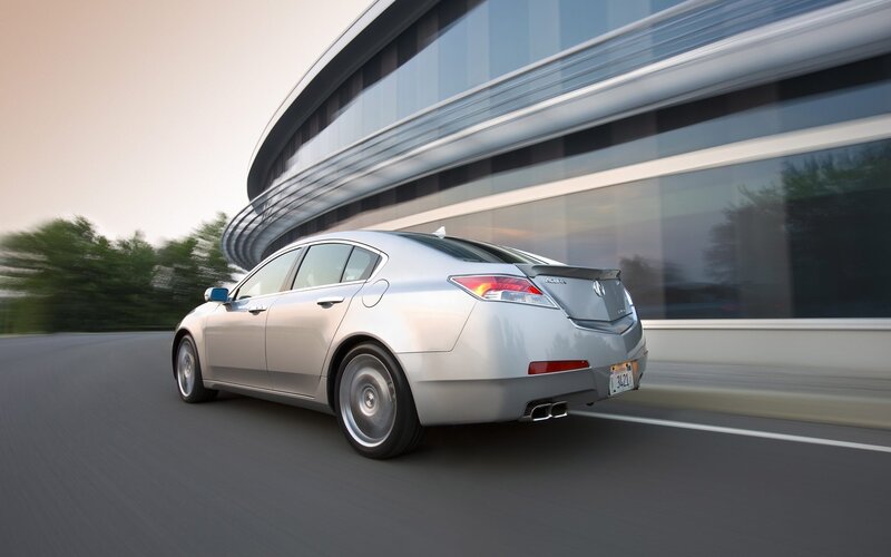 silver acura driving on road
