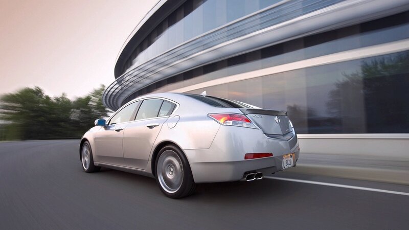 silver acura driving on road