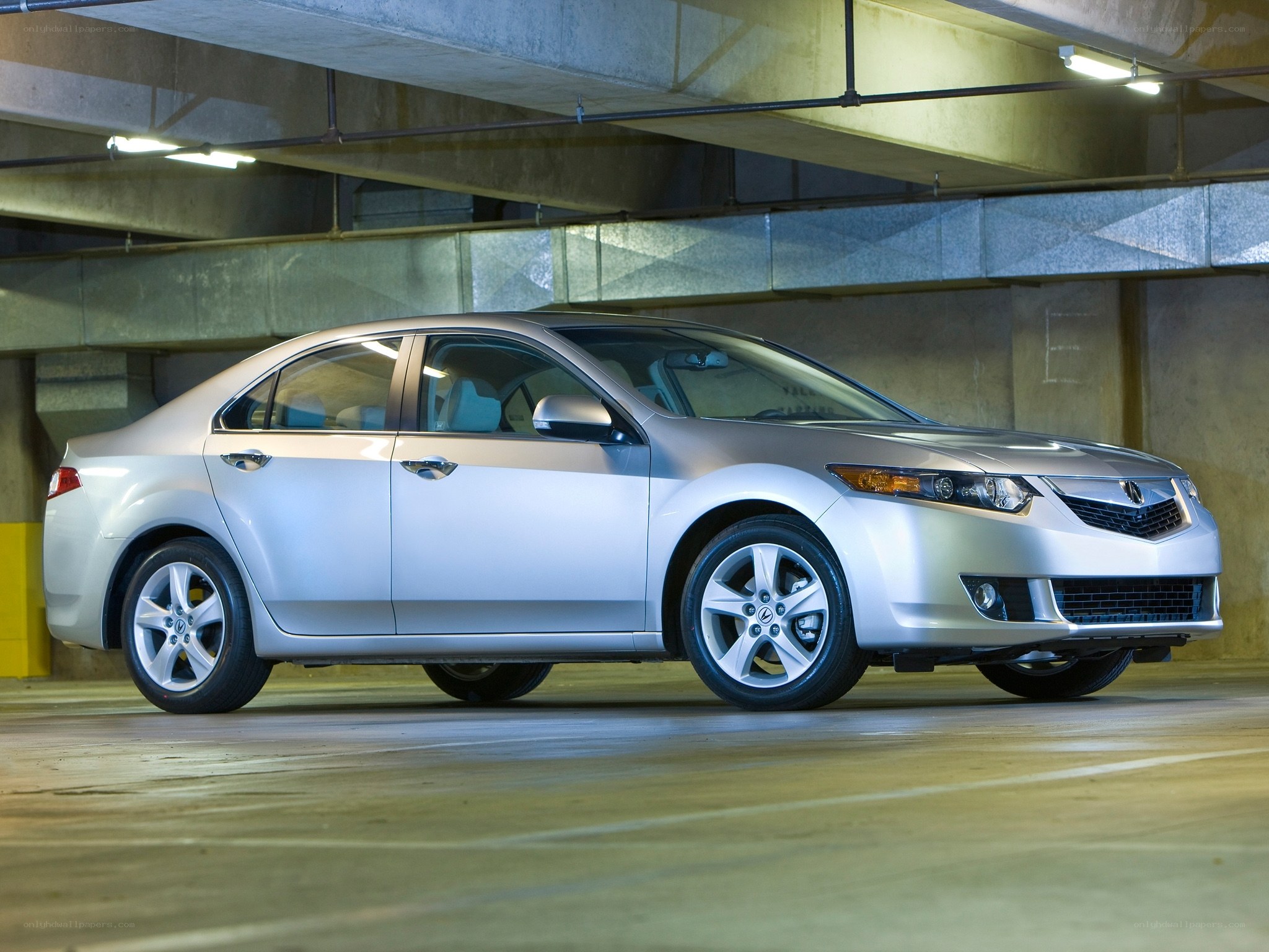 Silver Acura ILX in parking garage