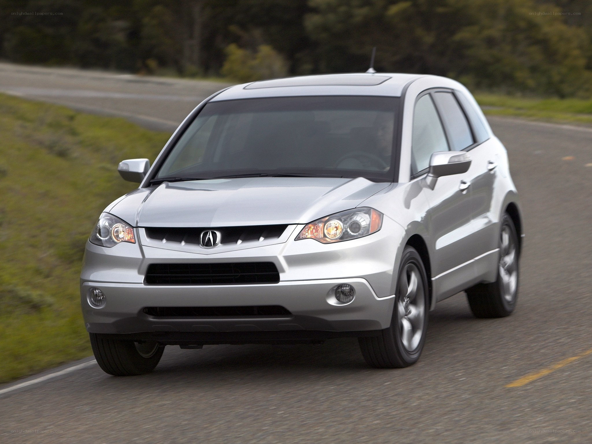 silver acura mdx driving on road