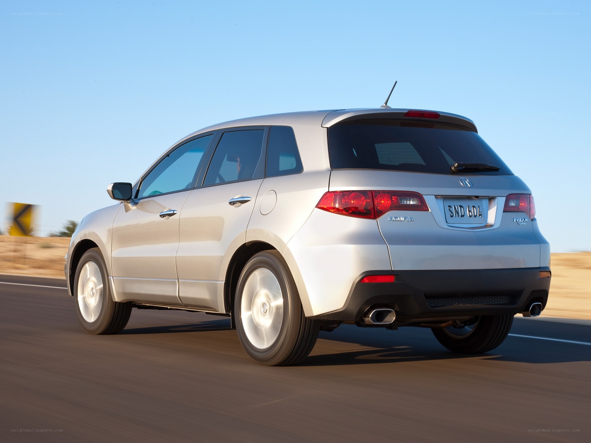 silver acura mdx driving