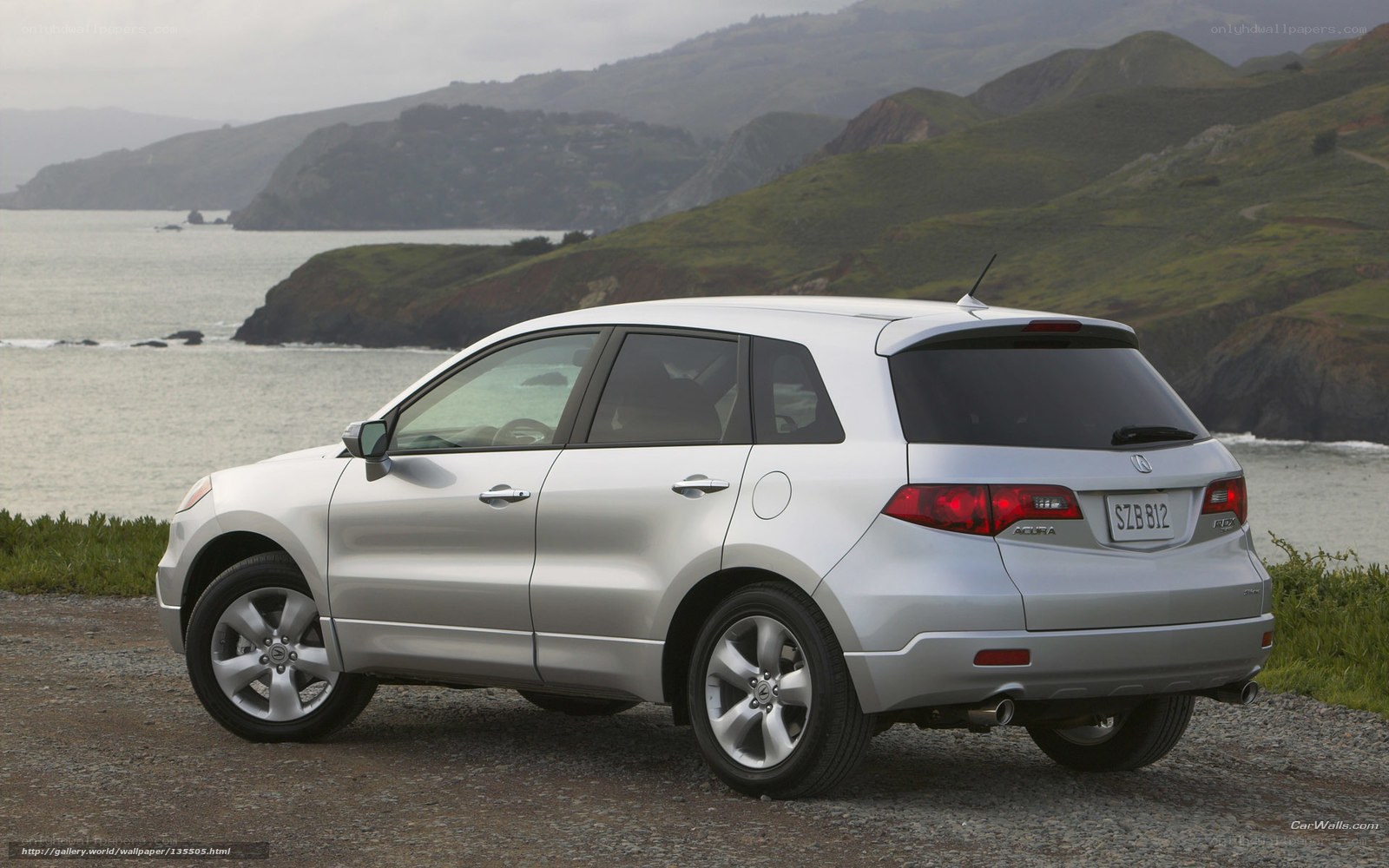 Silver Acura RDX by the coast