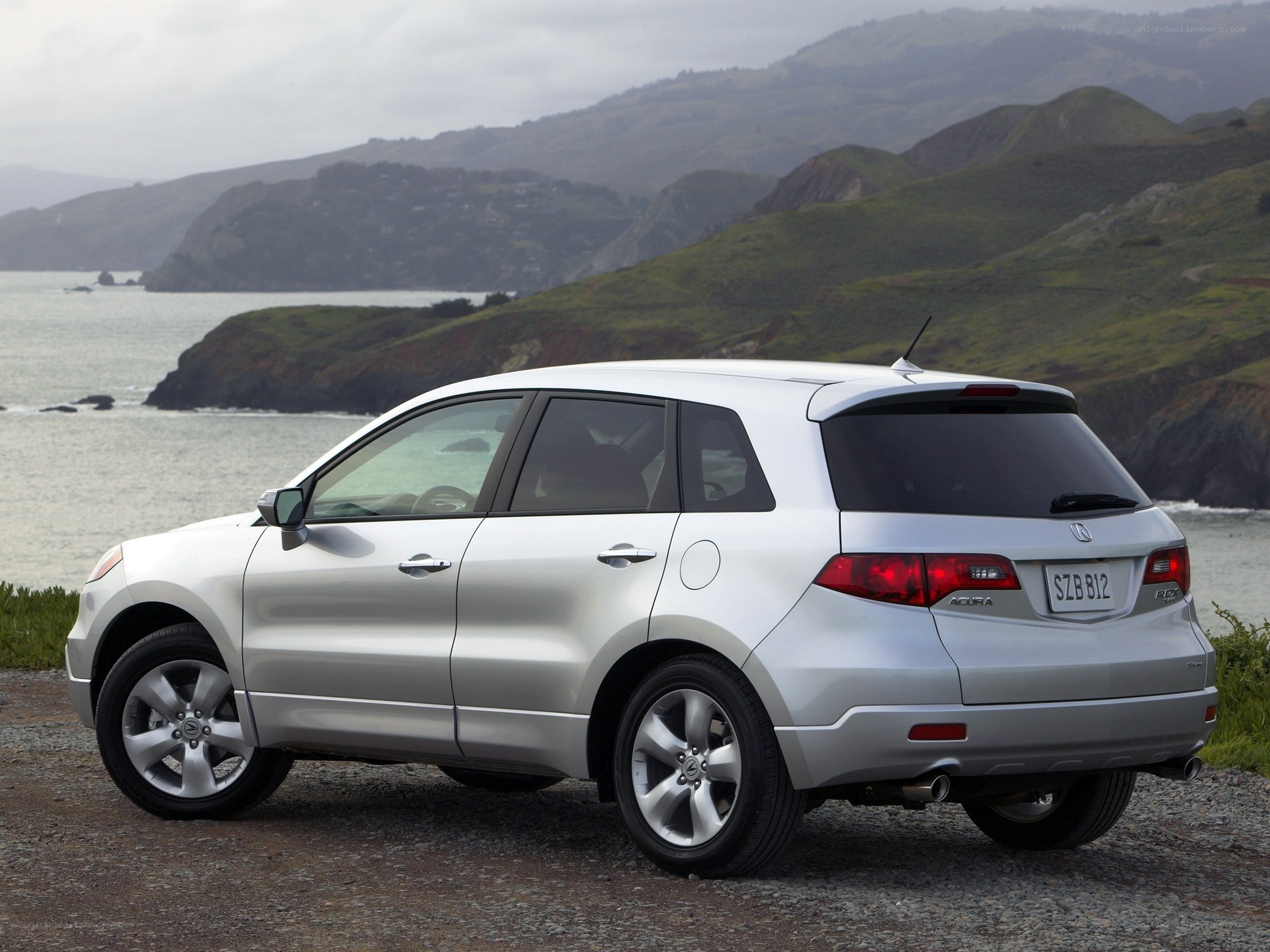 Silver Acura RDX by the coast