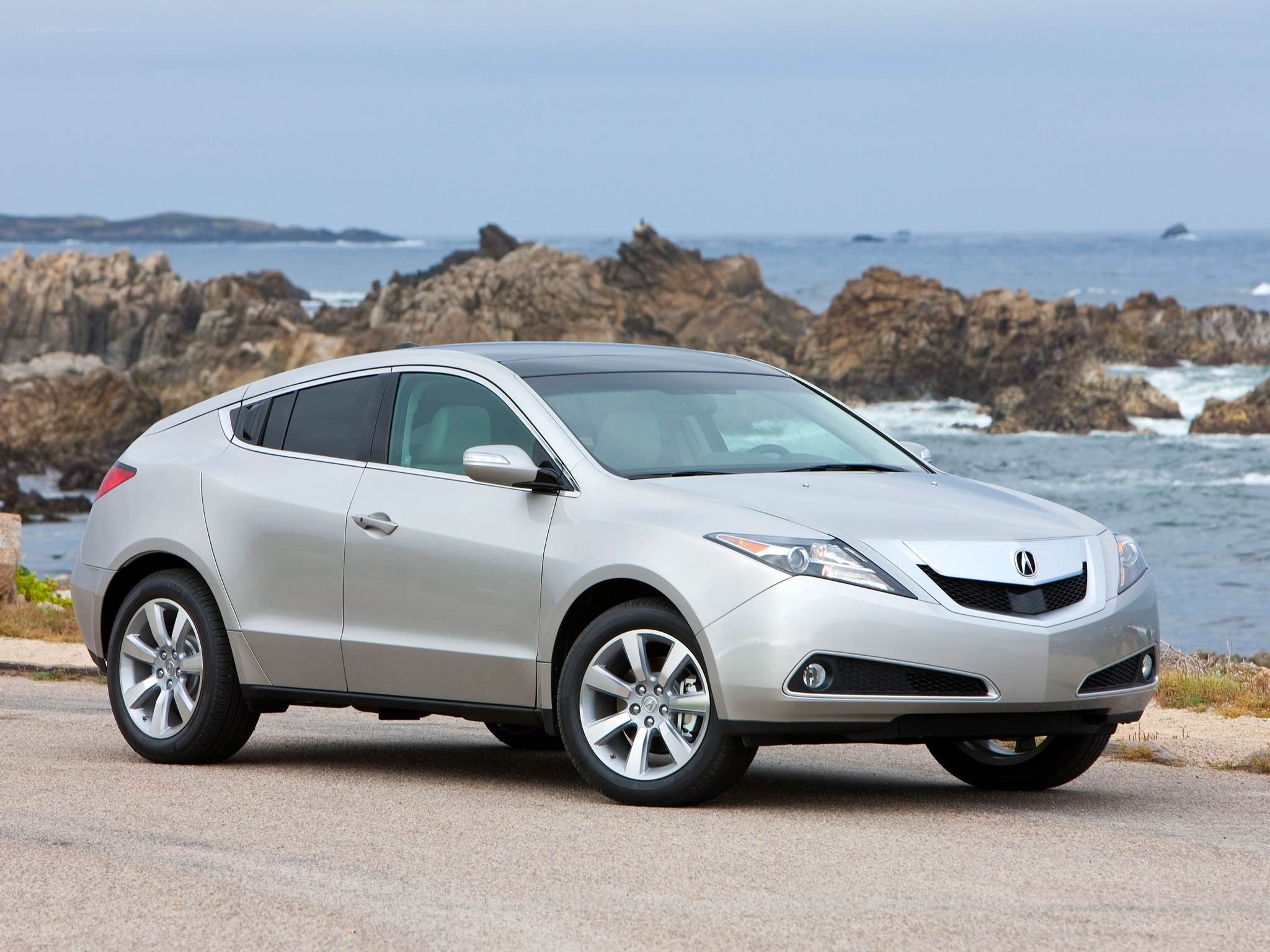 Silver Acura RDX by the coast