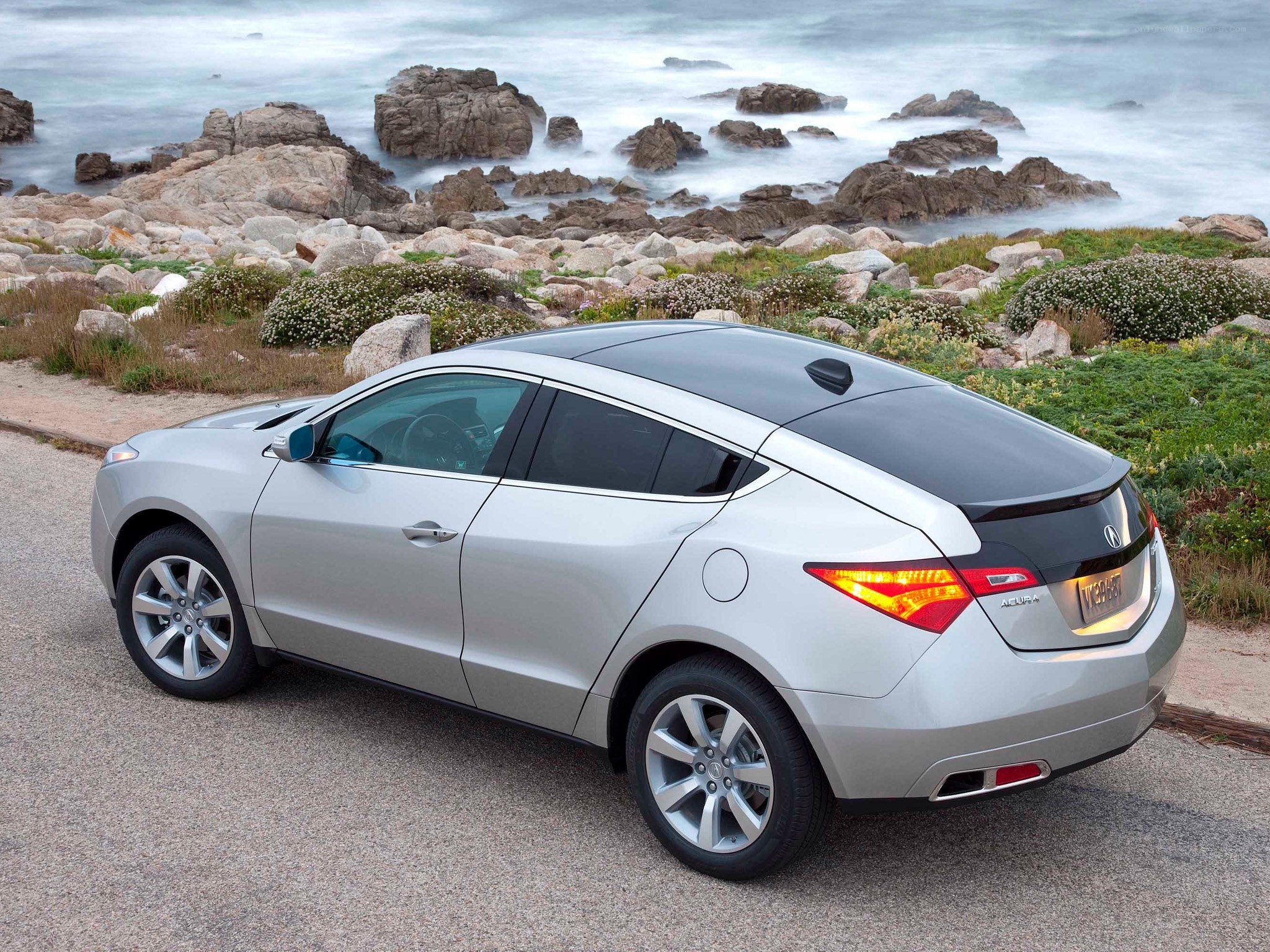 Silver Acura RDX by the coast