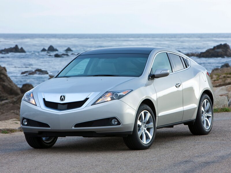 Silver Acura RDX by the ocean