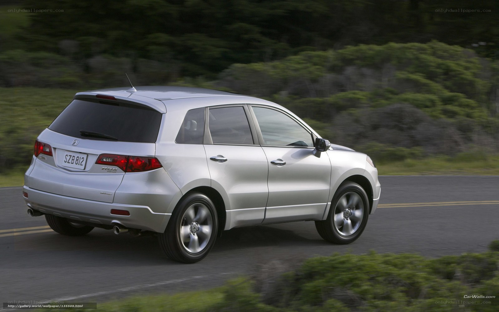 silver acura rdx driving on road